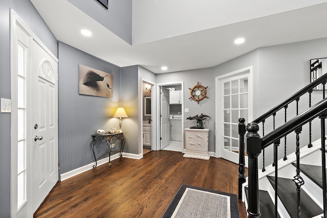 entryway with washer / dryer and dark hardwood / wood-style floors