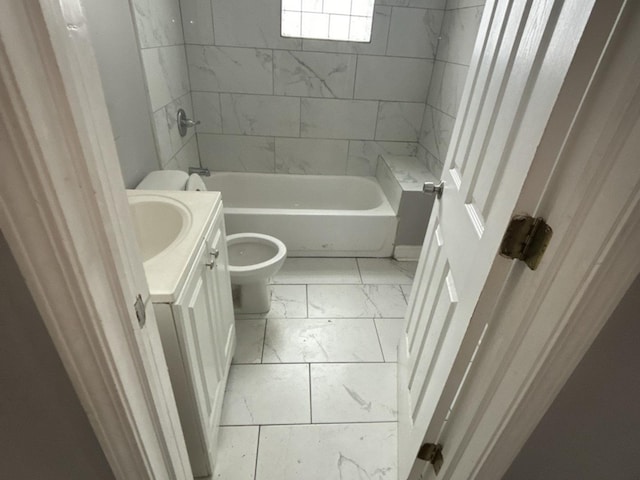 full bathroom featuring toilet, vanity, and tiled shower / bath combo