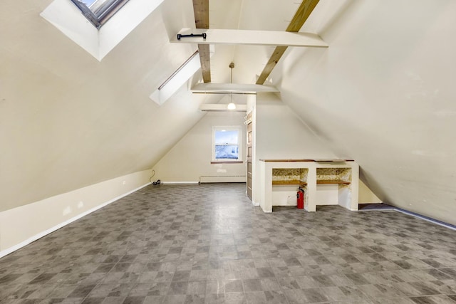 bonus room with baseboard heating and lofted ceiling with skylight