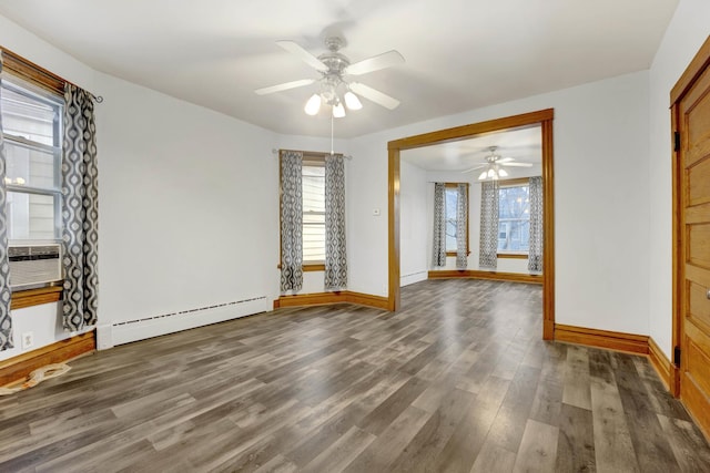 spare room featuring ceiling fan, baseboard heating, dark wood-type flooring, and cooling unit