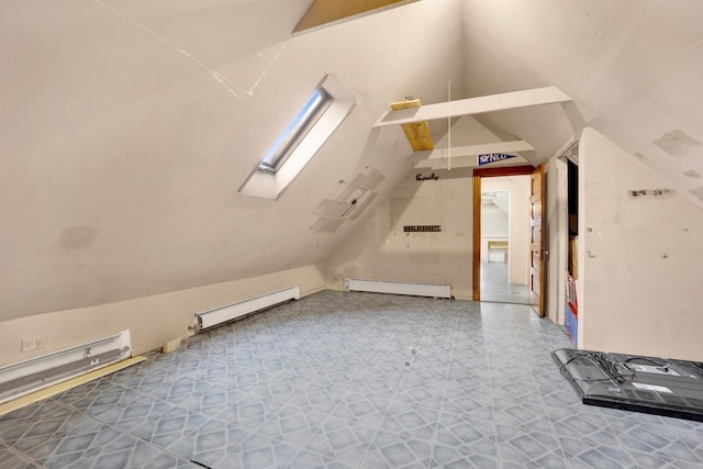 bonus room featuring a baseboard heating unit and vaulted ceiling with skylight