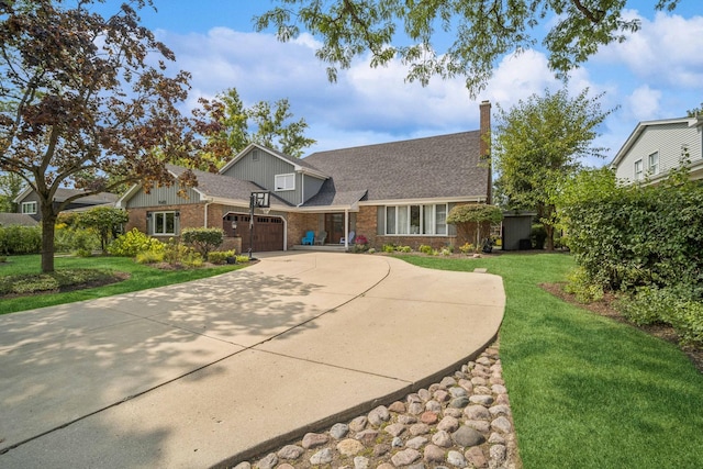 view of front facade with a garage and a front lawn