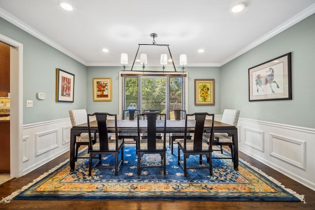 dining space featuring an inviting chandelier, ornamental molding, and dark hardwood / wood-style flooring