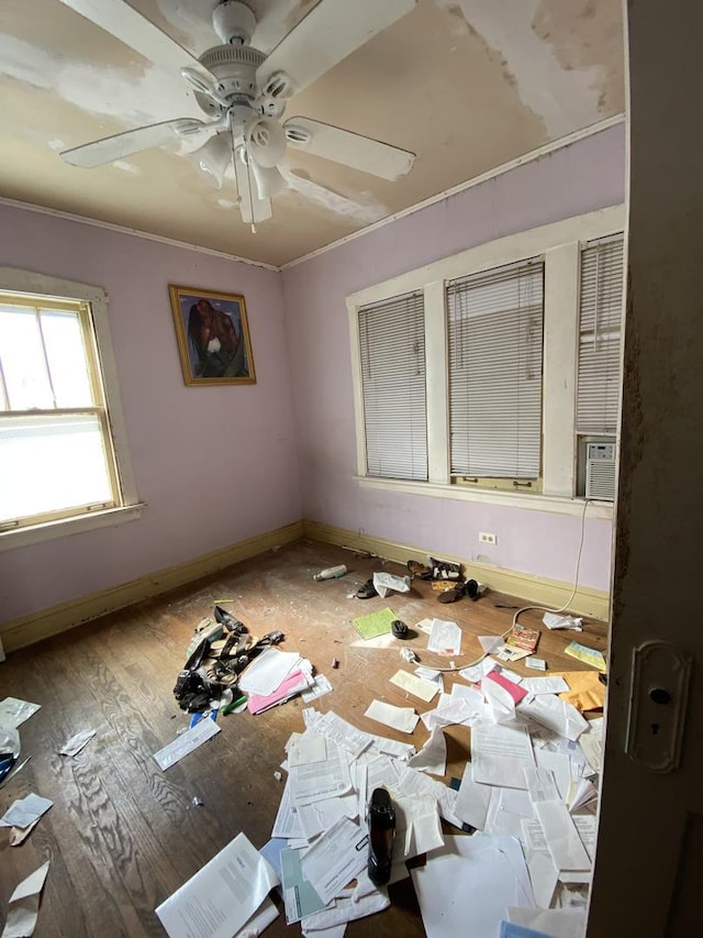 spare room featuring ceiling fan, hardwood / wood-style flooring, and ornamental molding