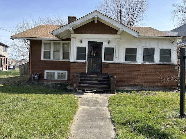 bungalow with a front lawn