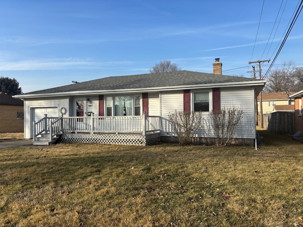 single story home with a garage and a front yard