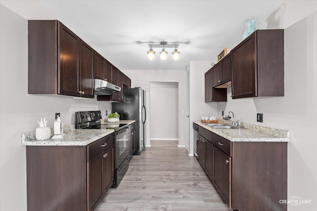 kitchen featuring dark brown cabinetry, stainless steel appliances, and sink