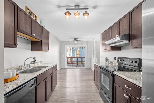 kitchen featuring sink, dark brown cabinetry, and black appliances