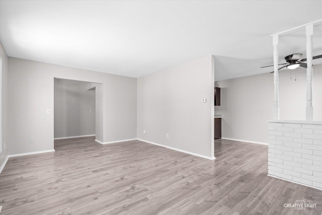 unfurnished room with ceiling fan and light hardwood / wood-style flooring