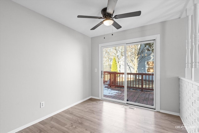 empty room with ceiling fan and light wood-type flooring