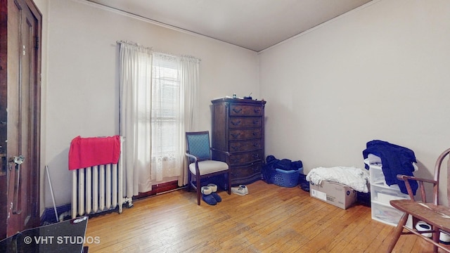 living area with hardwood / wood-style floors