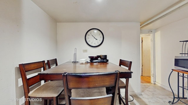 dining room featuring light tile patterned flooring