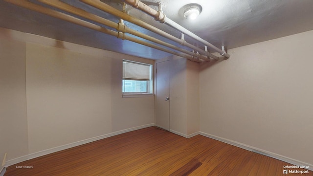 basement with wood-type flooring