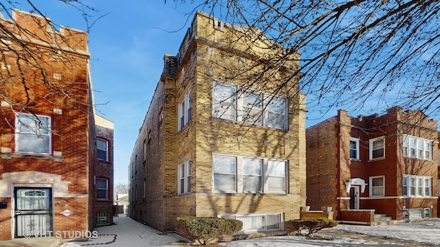 view of front facade featuring central AC