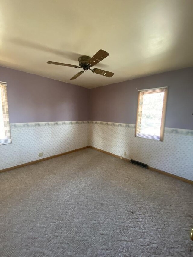 unfurnished room featuring ceiling fan