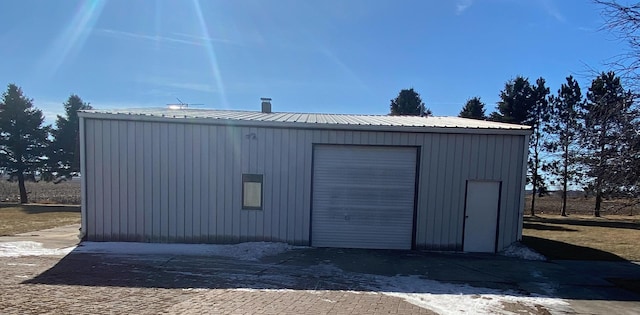 view of outbuilding with a garage