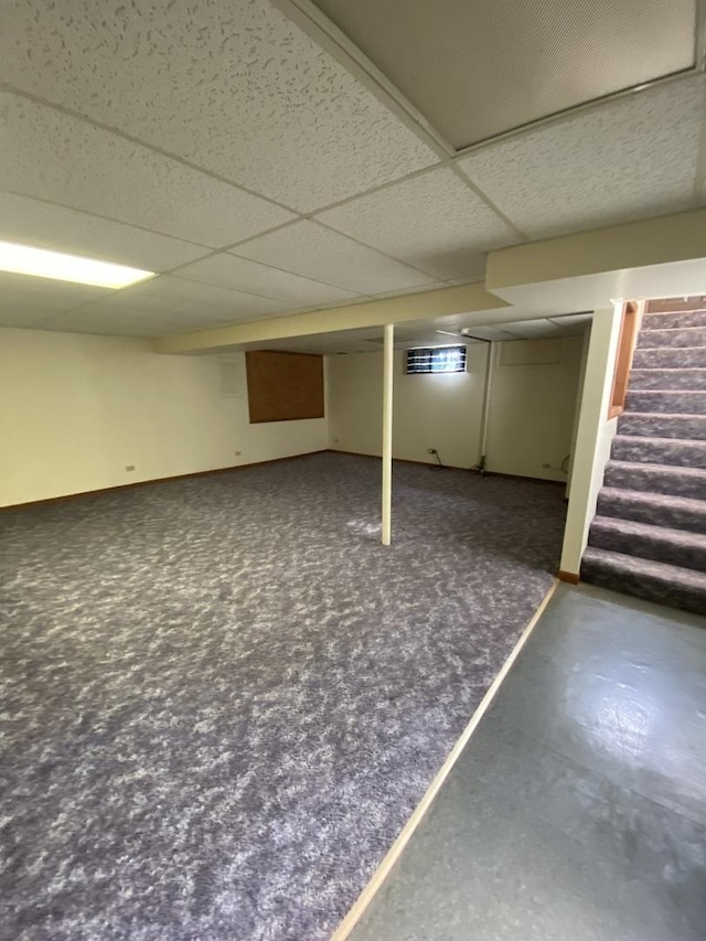 basement featuring a paneled ceiling