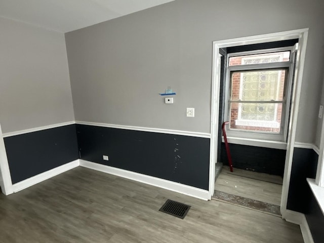 empty room featuring wood-type flooring