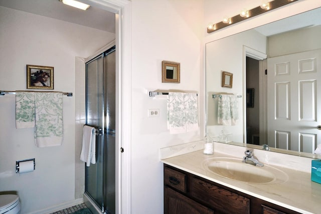 bathroom featuring walk in shower, vanity, and toilet