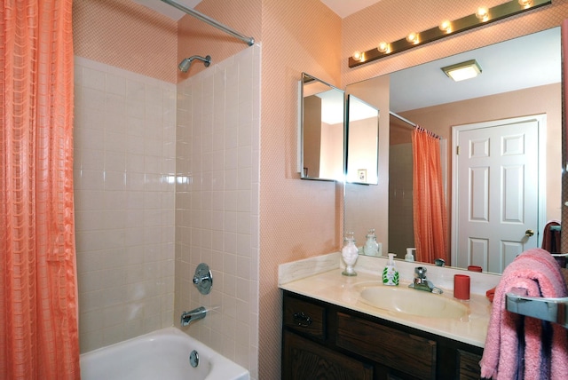 bathroom featuring shower / bathtub combination with curtain and vanity