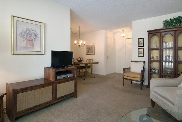 living room featuring light carpet, a notable chandelier, and a textured ceiling