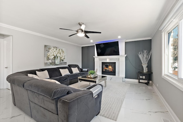 living room with crown molding and ceiling fan