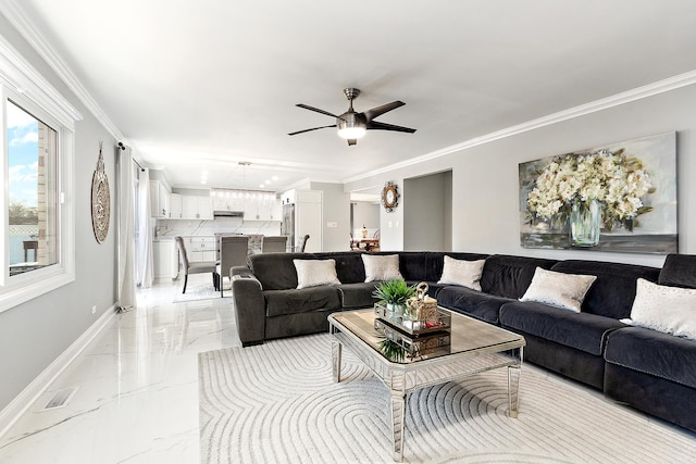 living room with crown molding and ceiling fan