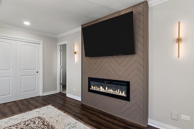 unfurnished living room featuring a fireplace, dark wood-type flooring, and ornamental molding