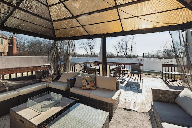 deck featuring a gazebo and outdoor lounge area