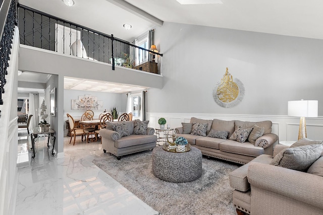 living room featuring beamed ceiling