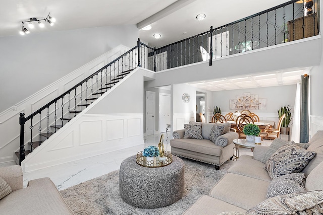 living room featuring beamed ceiling