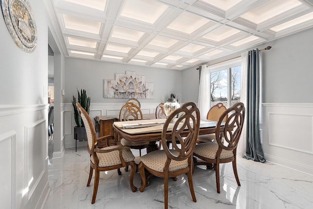 dining space with coffered ceiling and beam ceiling