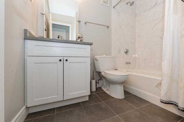 full bathroom featuring vanity, tile patterned floors, toilet, and shower / bath combo