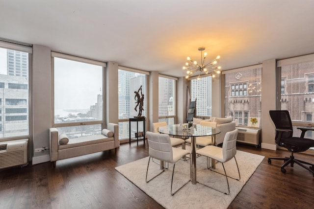 dining space featuring an inviting chandelier, dark hardwood / wood-style floors, and expansive windows