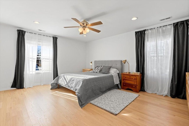 bedroom featuring ceiling fan and light hardwood / wood-style floors