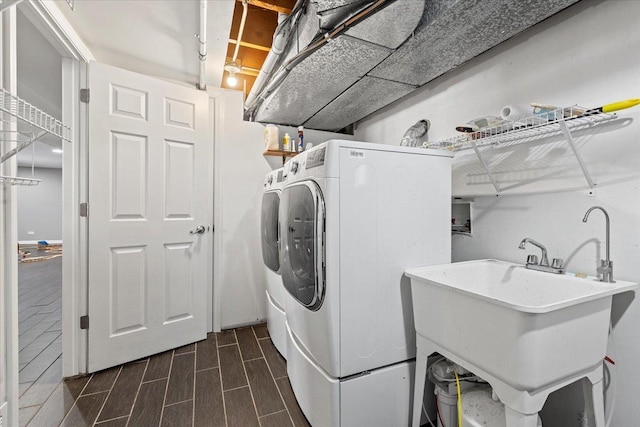 laundry room with washer and clothes dryer and sink