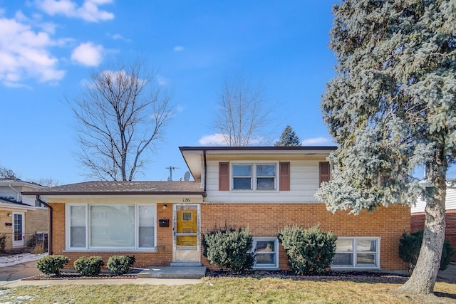 split level home with a front yard