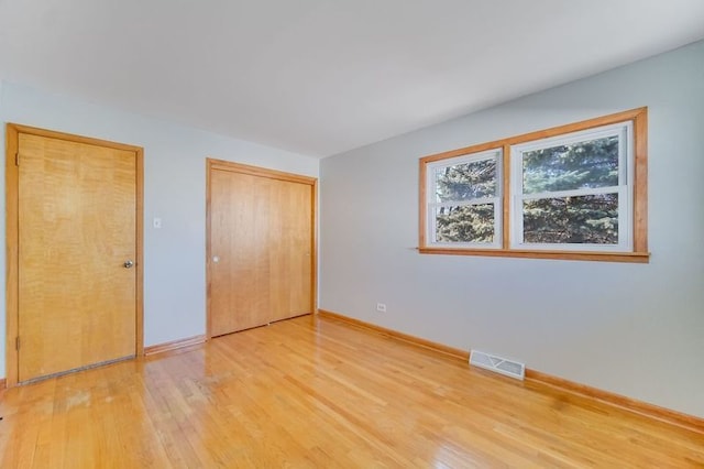 unfurnished bedroom featuring wood-type flooring