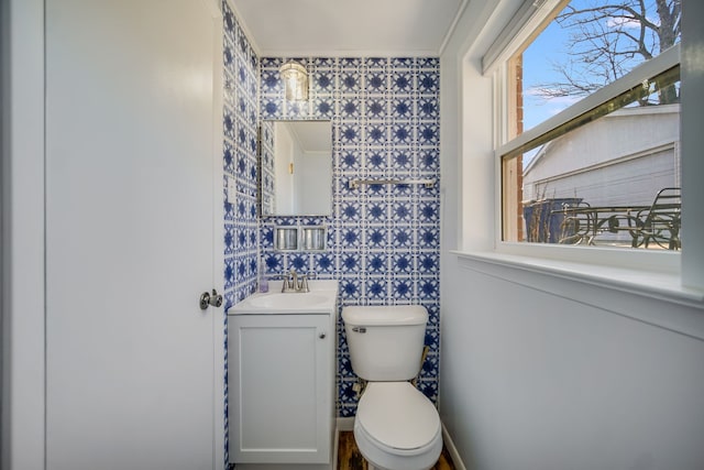 bathroom featuring toilet and vanity