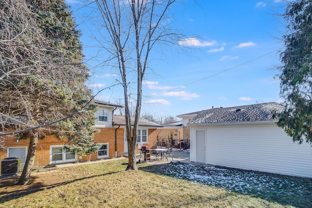 view of yard featuring a patio and central AC