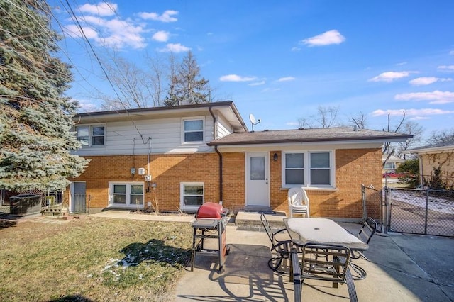 rear view of property featuring a patio area and a lawn