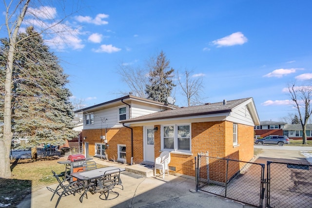 rear view of property featuring a patio