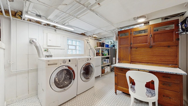 laundry room featuring cabinets and washing machine and clothes dryer