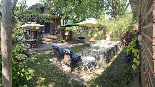 view of yard featuring a patio area and outdoor lounge area