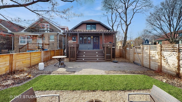 back of house featuring a patio area