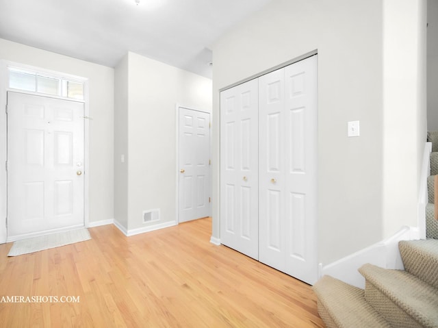 foyer entrance featuring hardwood / wood-style floors