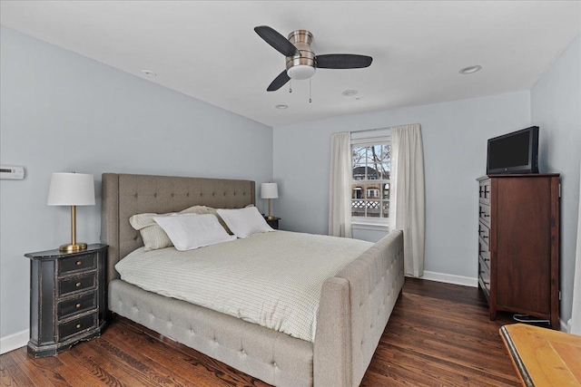 bedroom with ceiling fan and dark wood-type flooring