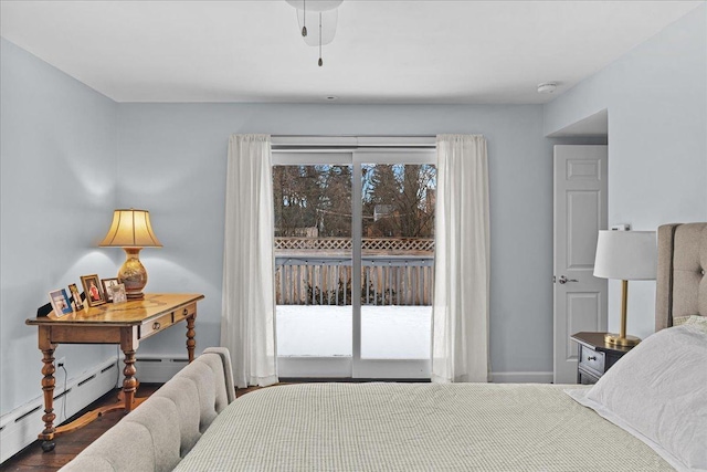 bedroom featuring ceiling fan, baseboard heating, and access to outside