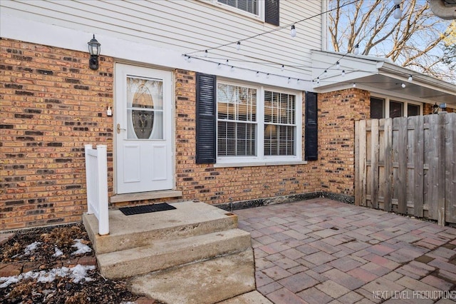 property entrance featuring a patio area