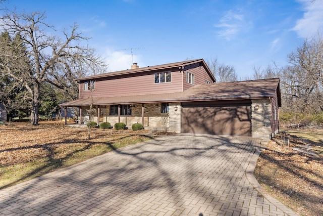 view of front of home featuring a garage and a porch